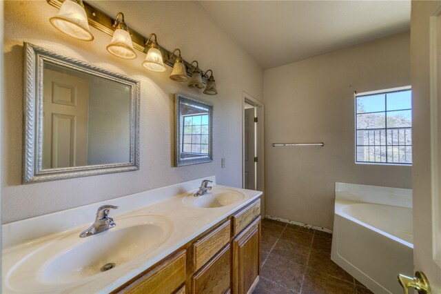 2230 Diamond Creek Rd, Bullhead City, AZ 86442 - full bath featuring plenty of natural light, a garden tub, double vanity, and tile patterned floors