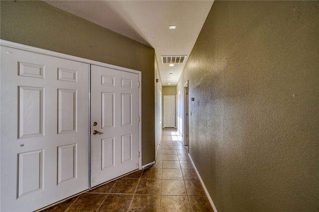 2230 Diamond Creek Rd, Bullhead City, AZ 86442 - corridor with dark tile patterned floors and baseboards