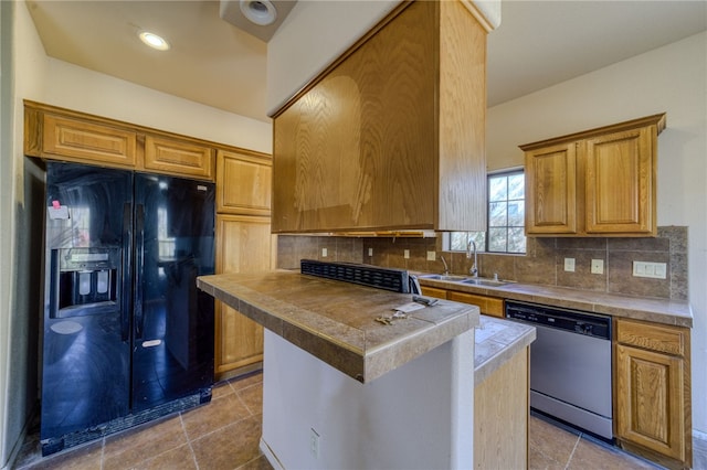 2230 Diamond Creek Rd, Bullhead City, AZ 86442 - kitchen featuring black refrigerator with ice dispenser, stainless steel dishwasher, backsplash, light tile patterned flooring, and brown cabinets
