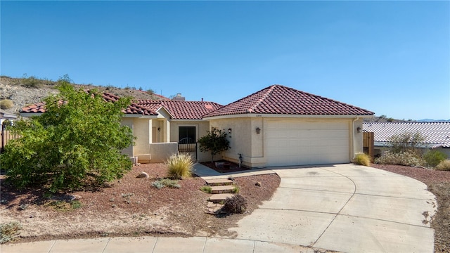 2230 Diamond Creek Rd, Bullhead City, AZ 86442 - mediterranean / spanish home with a tiled roof, a garage, driveway, stucco siding, and a chimney