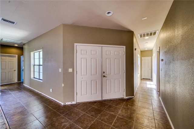 2230 Diamond Creek Rd, Bullhead City, AZ 86442 - entrance foyer with baseboards and dark tile patterned flooring