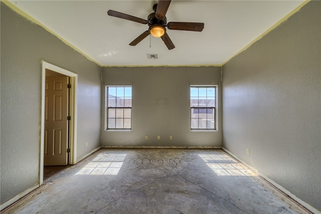 2230 Diamond Creek Rd, Bullhead City, AZ 86442 - spare room featuring plenty of natural light, a textured wall, ceiling fan, and ornamental molding