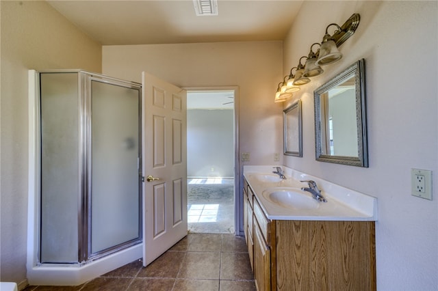 2230 Diamond Creek Rd, Bullhead City, AZ 86442 - full bathroom with double vanity, a stall shower, and tile patterned floors