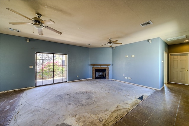 2230 Diamond Creek Rd, Bullhead City, AZ 86442 - unfurnished living room featuring ceiling fan and a tiled fireplace