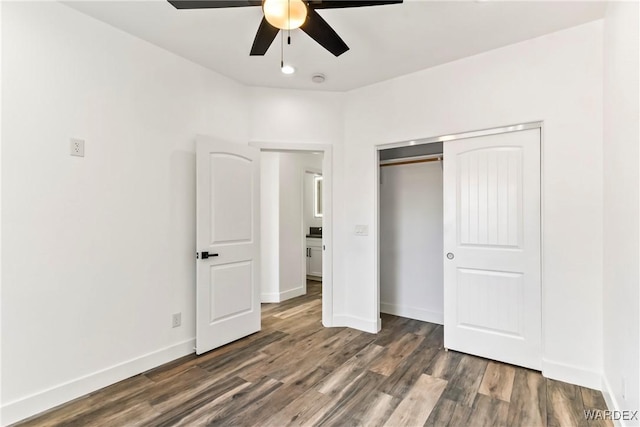 unfurnished bedroom with a ceiling fan, a closet, baseboards, and wood finished floors