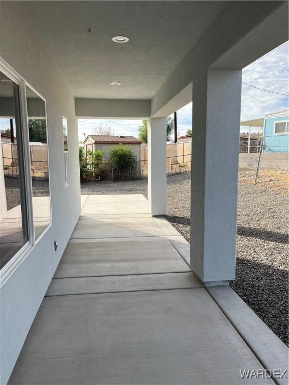 view of patio featuring fence