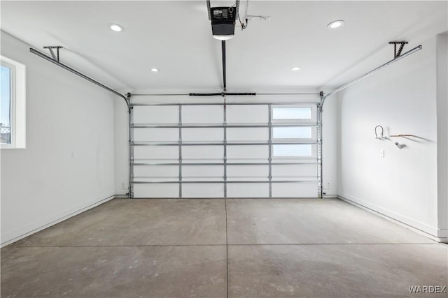 garage featuring baseboards, recessed lighting, and a garage door opener