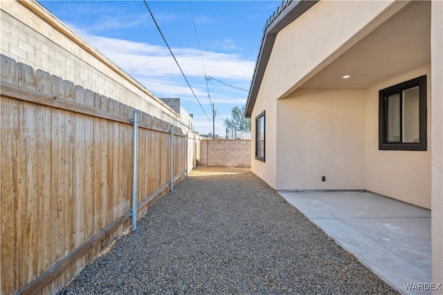 view of yard featuring a patio area and a fenced backyard