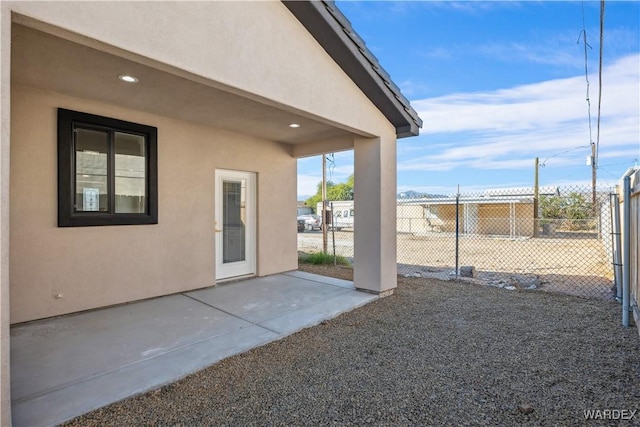 view of patio / terrace featuring fence