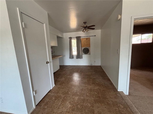 interior space with baseboards and stone finish flooring