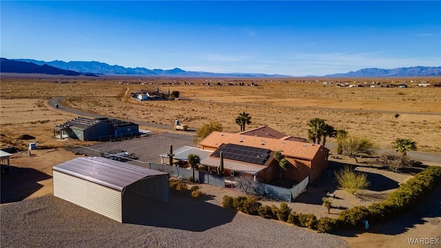 bird's eye view with view of desert and a mountain view