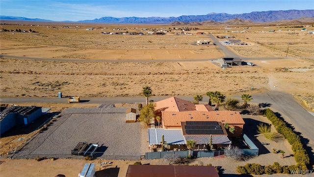 bird's eye view with a mountain view and a desert view