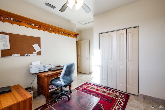 office space featuring attic access, visible vents, ceiling fan, and light tile patterned flooring