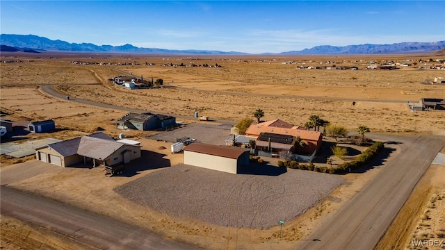 birds eye view of property with a mountain view, a desert view, and a rural view