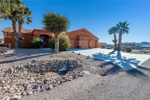 view of front of home featuring a garage and stucco siding