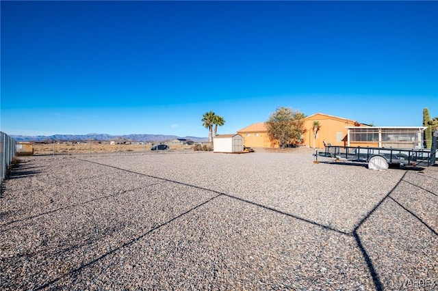 exterior space with driveway and a mountain view