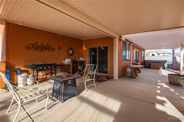 view of patio / terrace featuring a hot tub