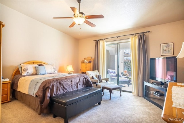 bedroom featuring access to outside, a ceiling fan, and light colored carpet