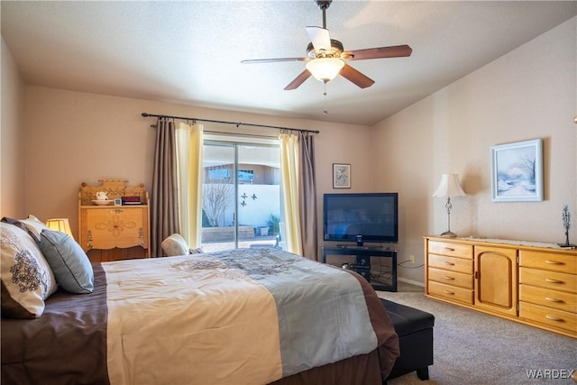 bedroom with a ceiling fan, access to outside, and light carpet