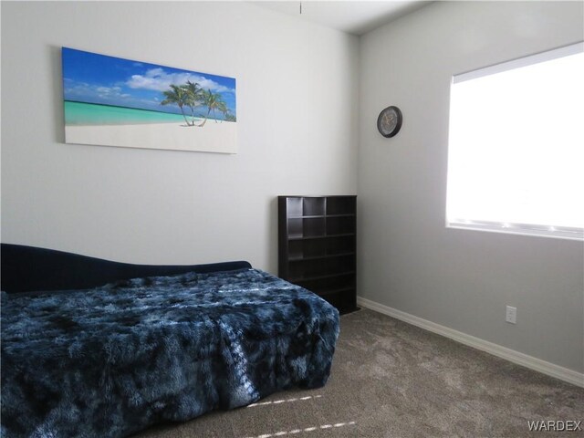 carpeted bedroom with baseboards