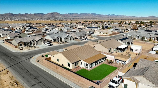 drone / aerial view with a residential view and a mountain view