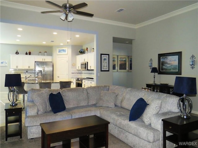 living room with recessed lighting, visible vents, crown molding, and ceiling fan