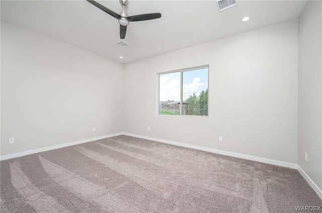 carpeted empty room with a ceiling fan, recessed lighting, visible vents, and baseboards