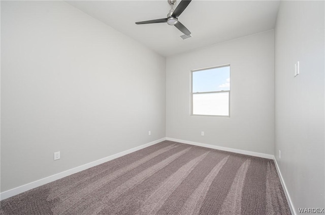 unfurnished room featuring ceiling fan, carpet, visible vents, and baseboards