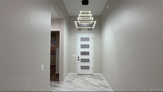 interior space with marble finish floor and baseboards