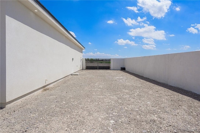 view of yard featuring a gate and fence