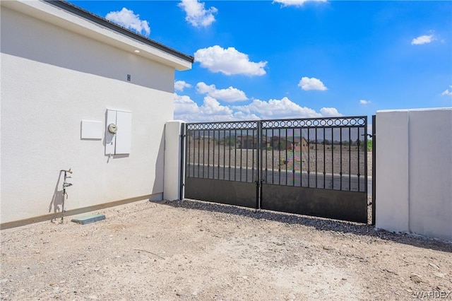 view of gate with fence