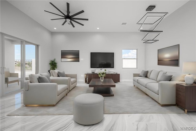 living room with marble finish floor, ceiling fan, french doors, and recessed lighting