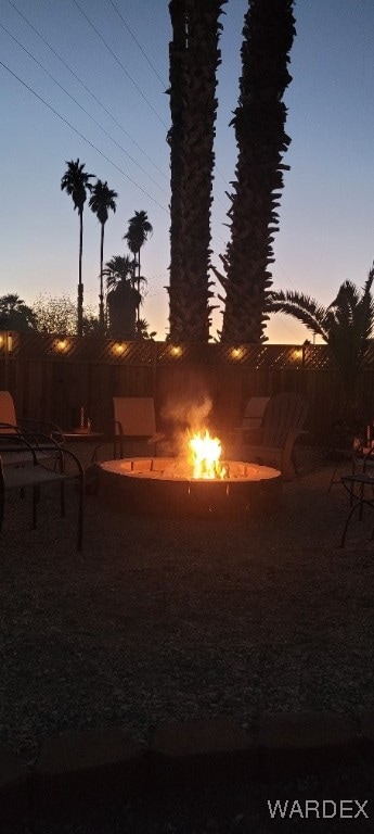 view of yard featuring an outdoor fire pit