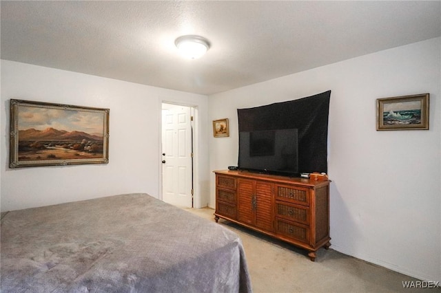 bedroom featuring light colored carpet