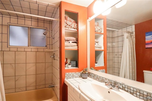 bathroom featuring shower / bath combination with curtain and vanity