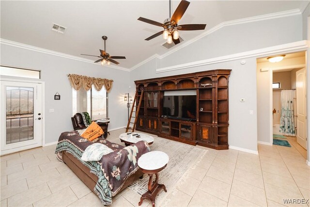 living room with crown molding, visible vents, light tile patterned flooring, vaulted ceiling, and baseboards