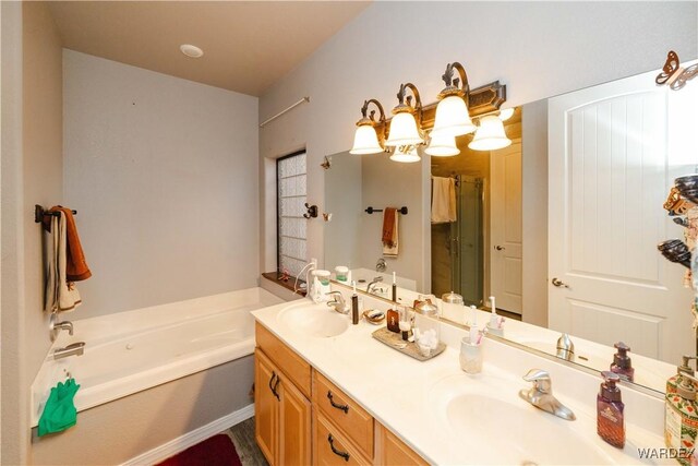 full bathroom with double vanity, a sink, and a bath