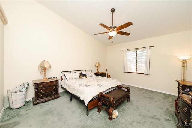 carpeted bedroom featuring vaulted ceiling, a ceiling fan, and baseboards