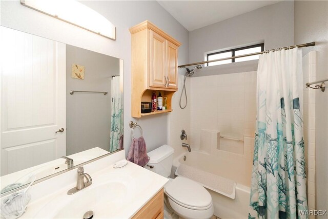 full bath with shower / bath combo, vanity, and toilet