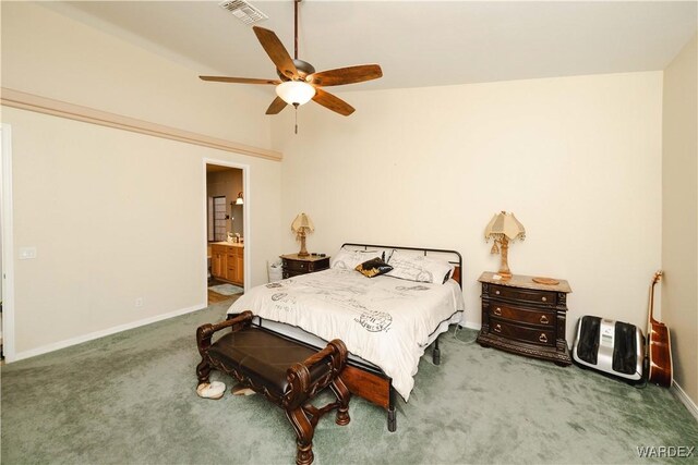 bedroom with visible vents, baseboards, a ceiling fan, ensuite bath, and carpet