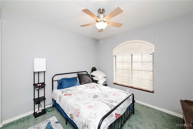 bedroom with carpet floors, baseboards, and a ceiling fan