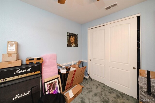 office area featuring ceiling fan, carpet floors, visible vents, and baseboards