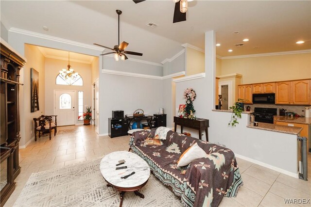 living room with ceiling fan with notable chandelier, visible vents, ornamental molding, and light tile patterned flooring