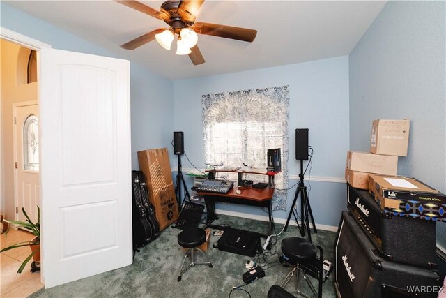 office area featuring baseboards and a ceiling fan