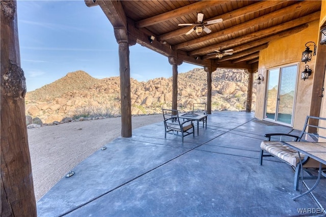 view of patio / terrace featuring outdoor dining area and a ceiling fan