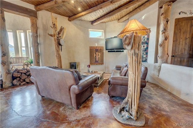 living room with beamed ceiling, wood ceiling, and finished concrete floors