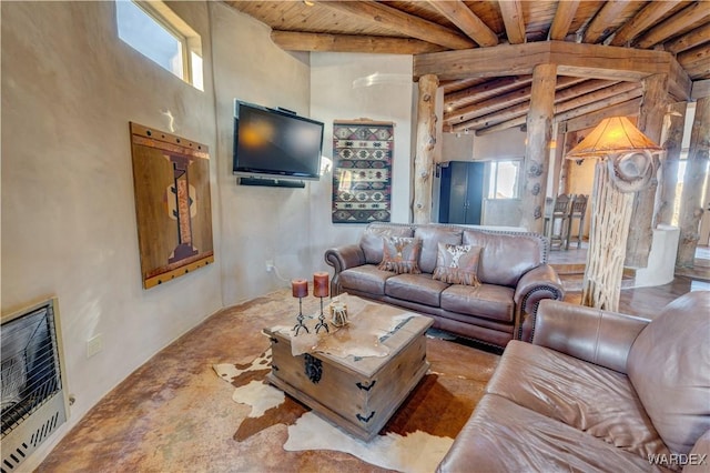 living room featuring beamed ceiling, heating unit, and wood ceiling