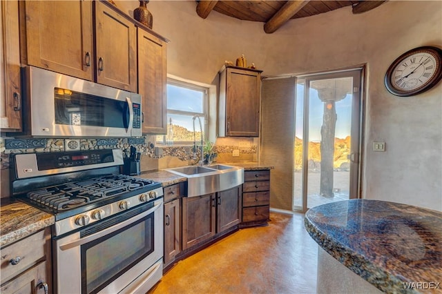 kitchen featuring decorative backsplash, beamed ceiling, appliances with stainless steel finishes, and wood ceiling