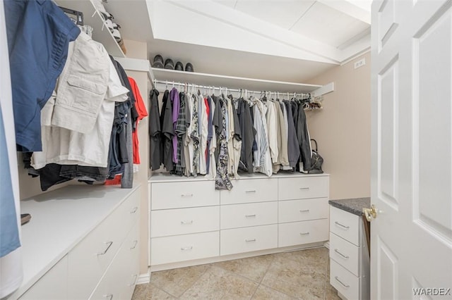 walk in closet featuring light tile patterned floors