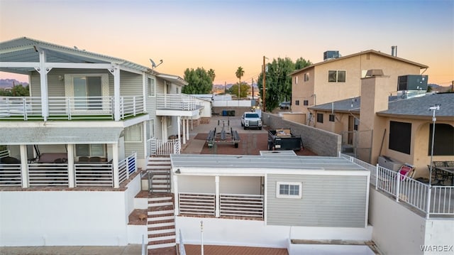 exterior space featuring a balcony and stairway